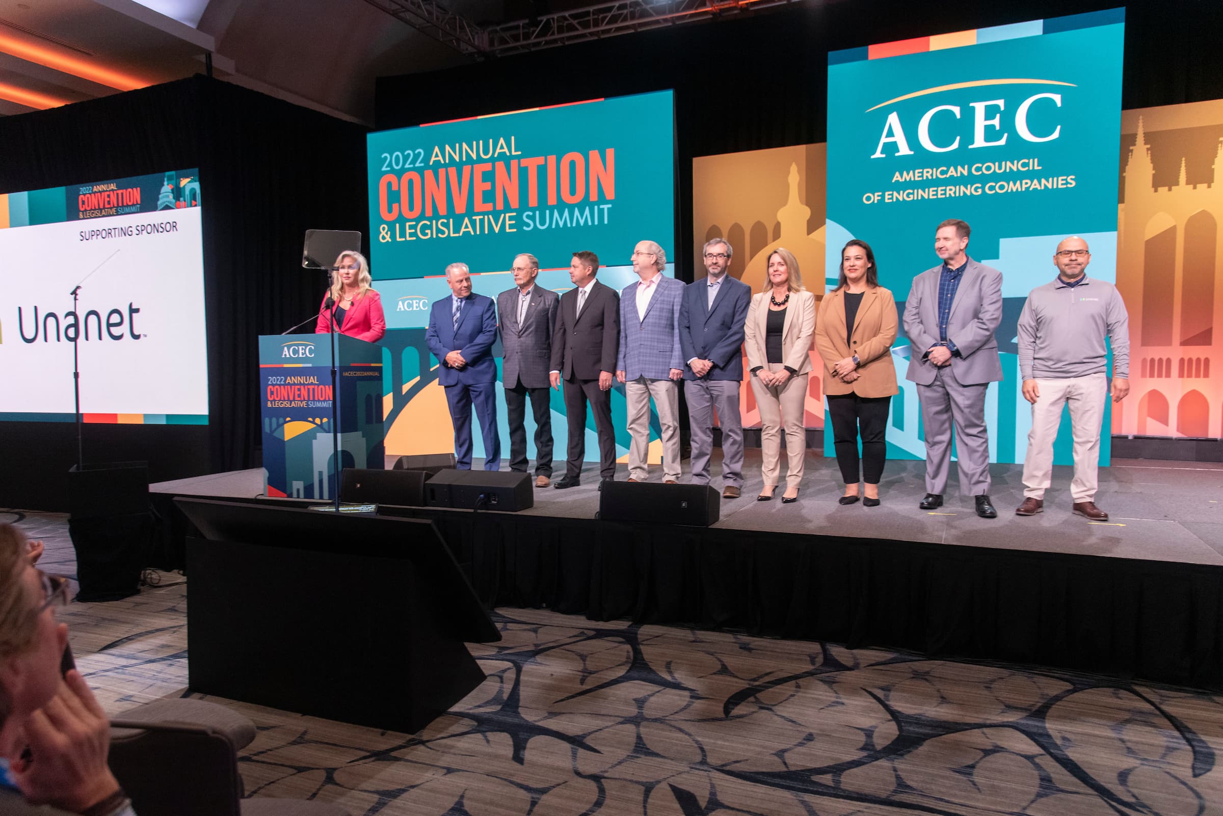 ACEC8803-2739 Awardees and other members standing on the stage during the ACEC 2022 annual convention and legislative summit