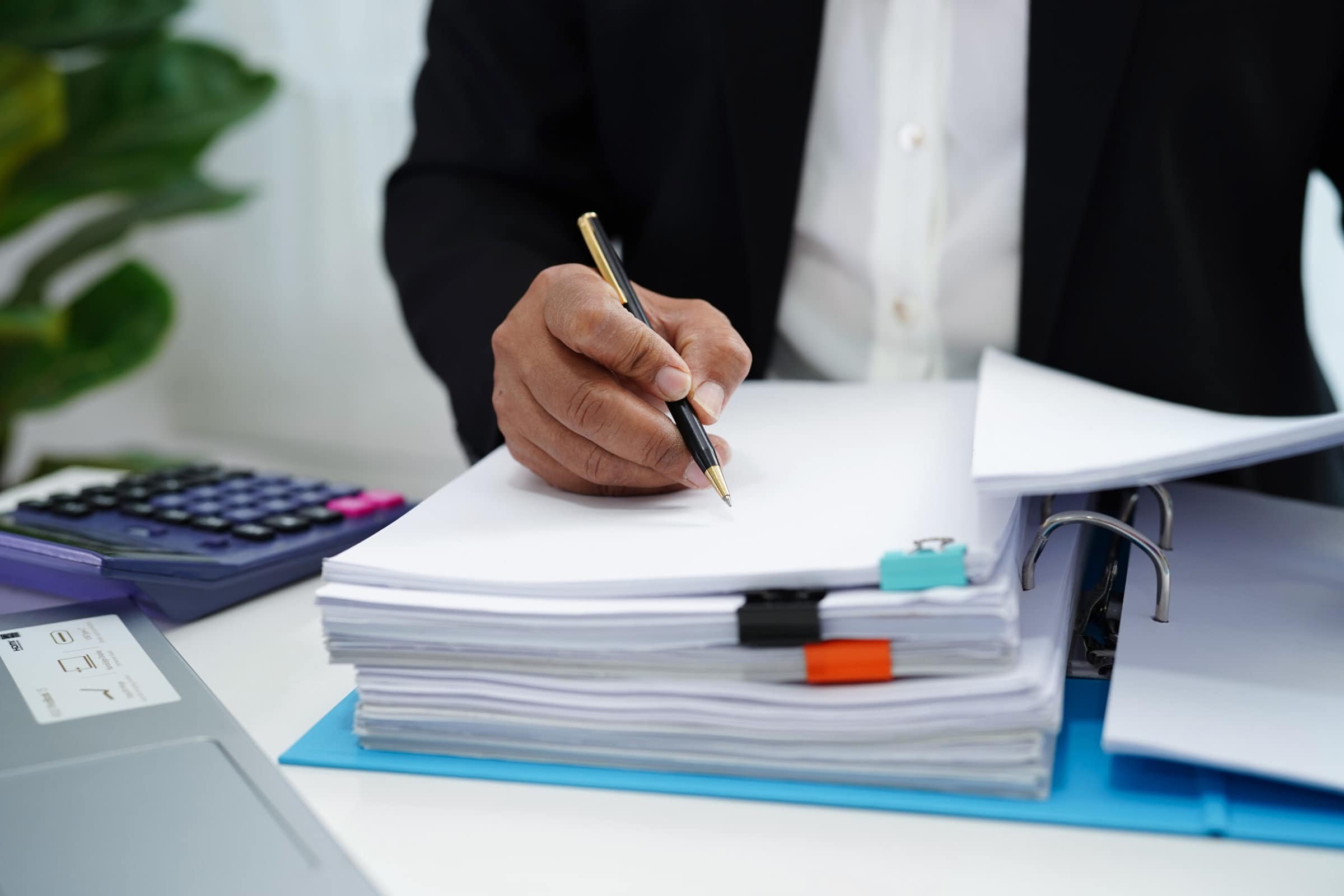 Business woman busy working with documents in office. Business woman busy working with documents in office.