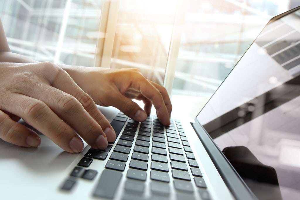 Double exposure of business man hand working on blank screen laptop computer on wooden desk as concept Double exposure of business man hand working on blank screen laptop computer on wooden desk as concept