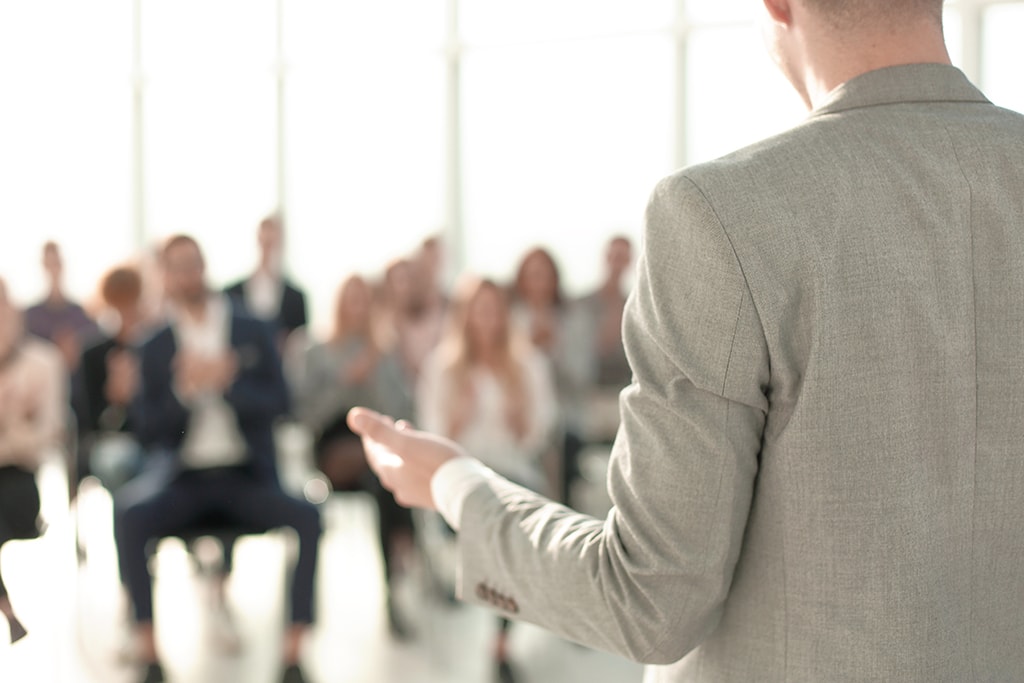 image of a speaker giving a lecture at a business seminar close up. image of a speaker giving a lecture at a business seminar