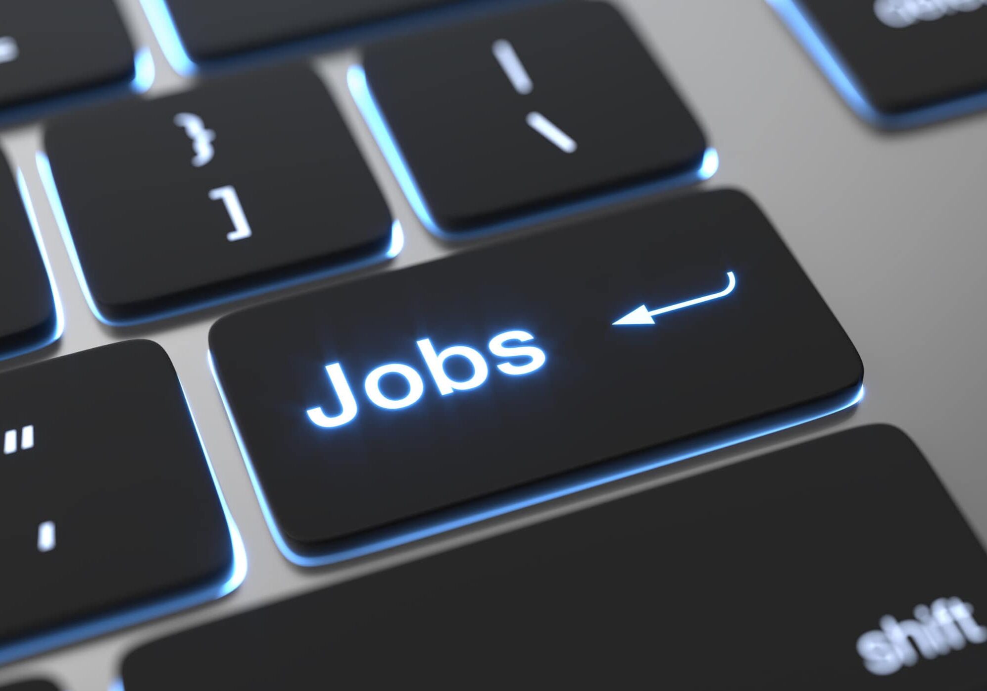Find a job concept. Jobs text on keyboard button.
