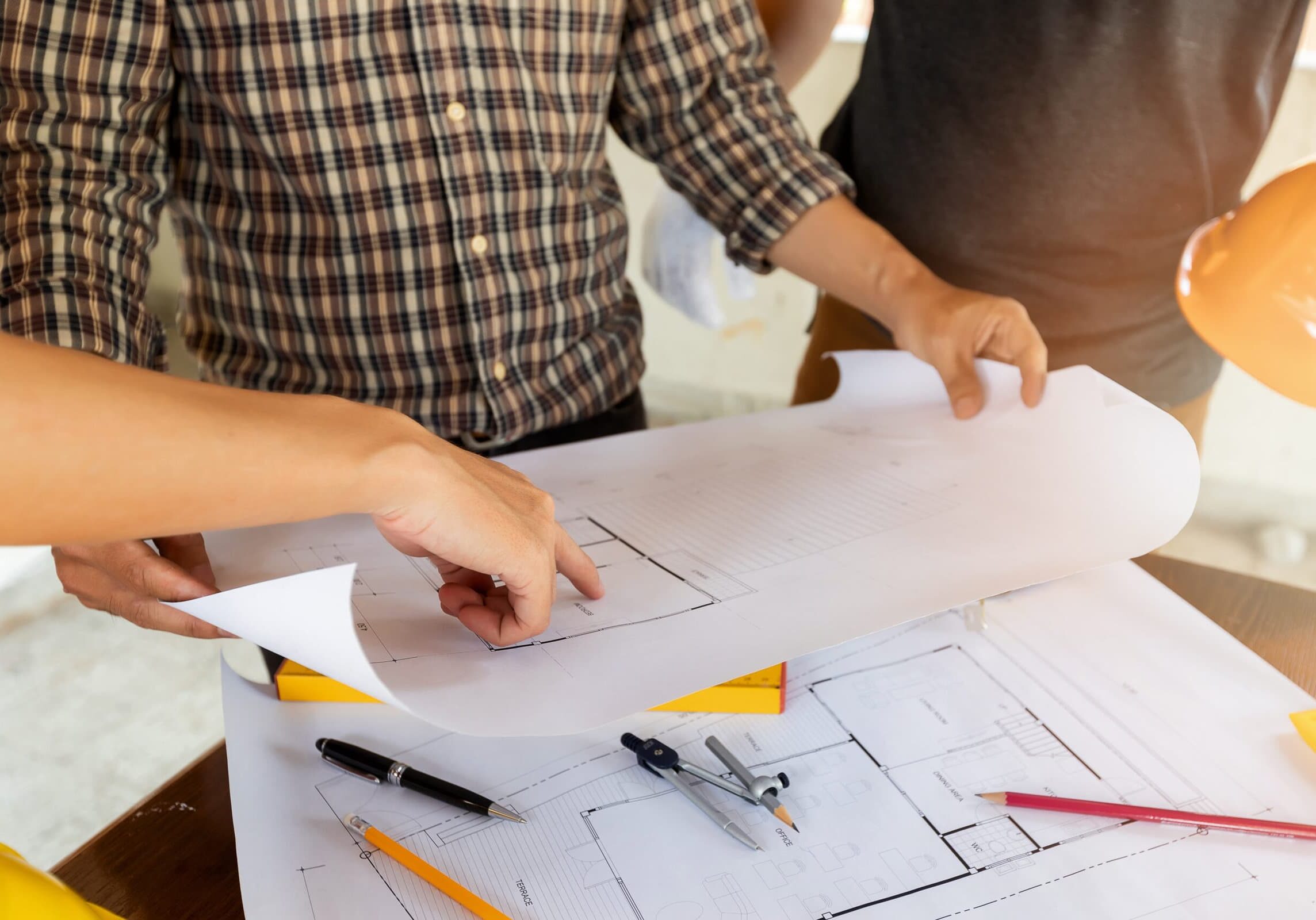 Architect,Discuss,With,Engineer,About,Project,In,Office,,Architectural,Concept close up photo of architect's hands discussing about a project