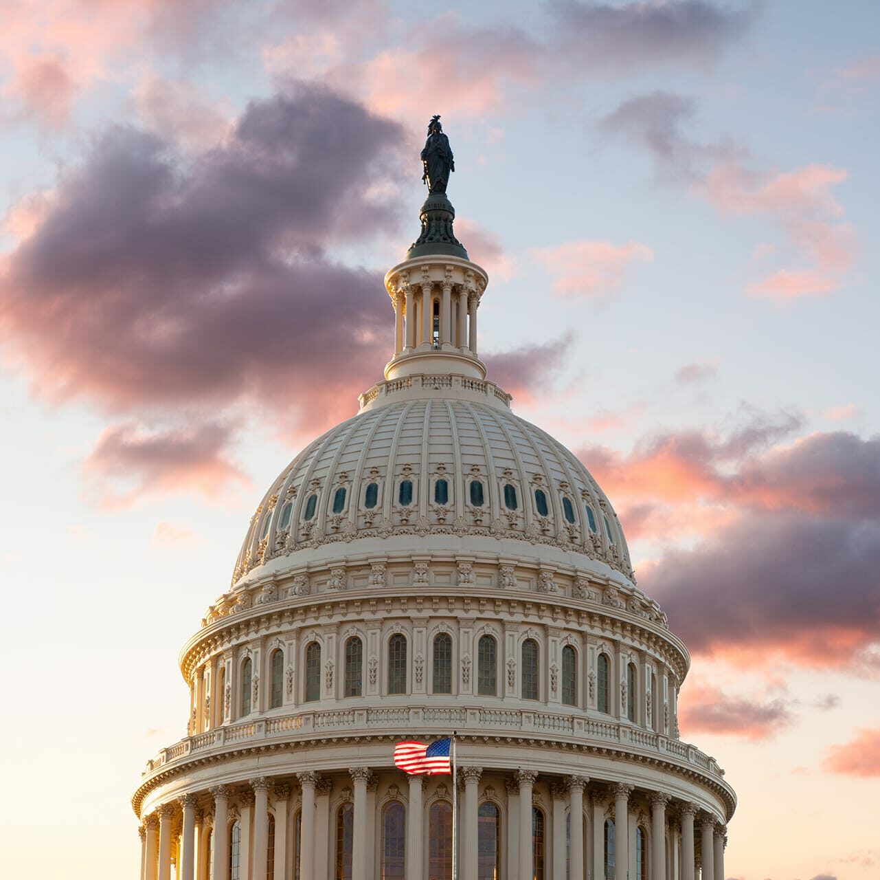 us-flag-flies-front-us-capitol-washington-dc-as-sun-rises-dawn-new-day us-flag-flies-front-us-capitol-washington-dc-as-sun-rises-dawn-new-day