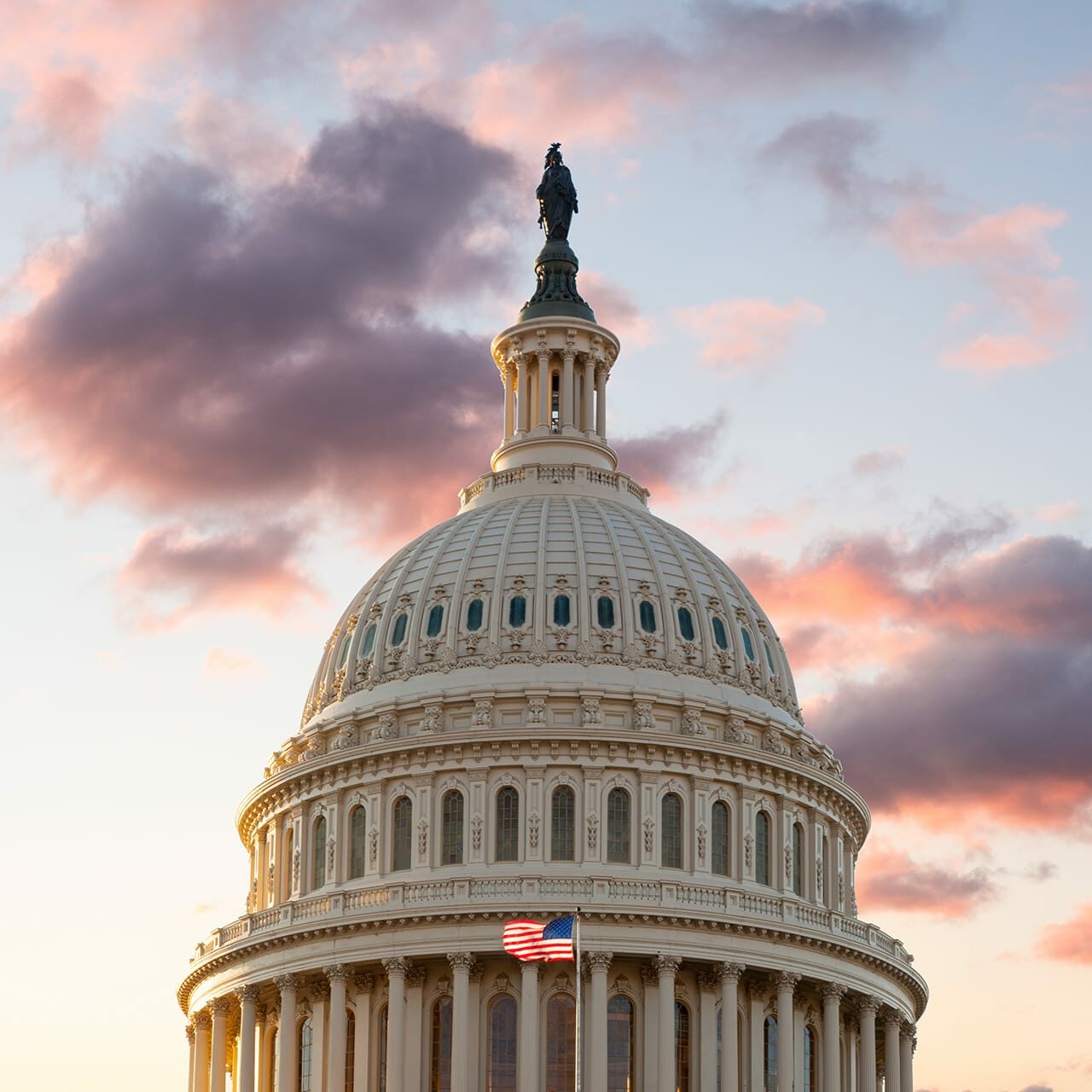 us-flag-flies-front-us-capitol-washington-dc-as-sun-rises-dawn-new-day us-flag-flies-front-us-capitol-washington-dc-as-sun-rises-dawn-new-day